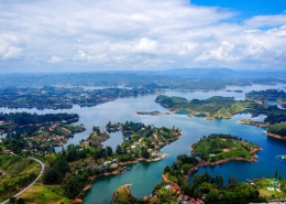 view from the top of the rock in guatape colombia with surrounding islands and lakes