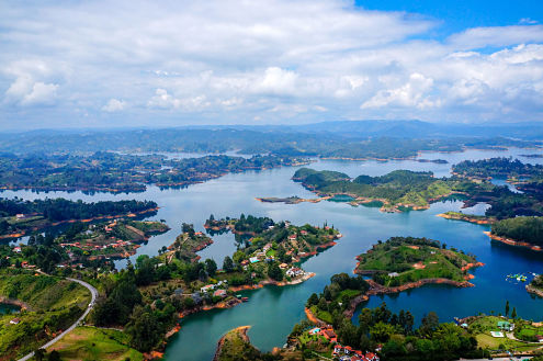 view from the top of the rock in guatape colombia with surrounding islands and lakes